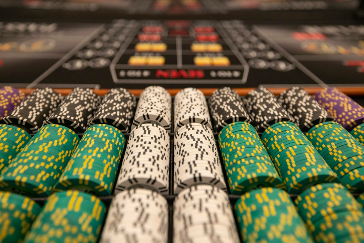 a close up of many different colored poker chips